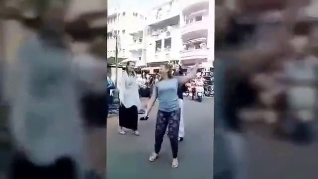Most beautiful girl dancing in public place.