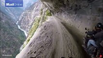 That's a big drop! Biker ride world's most dangerous road