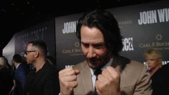 Keanu Reeves Feels The Suit At 'John Wick: Chapter 2' Premiere
