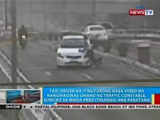 Taxi driver na itinuturong nasa video na nangwasiwas umano ng traffic constable, sumuko