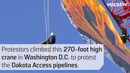 Activists Climb 270-Foot Crane In D.C. To Protest Trump