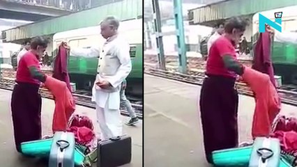 Swami Om caught taking off clothes at railway station