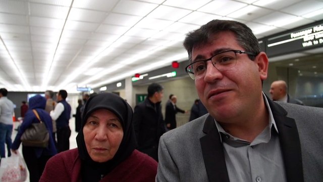 Green-card holder reunites with family at Dulles airport