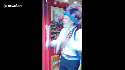 Morris dancers parade through shop in Liverpool
