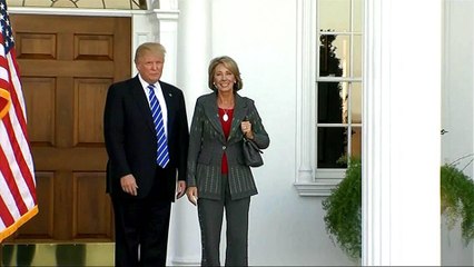 Betsy DeVos narrowly sworn in as US education secretary