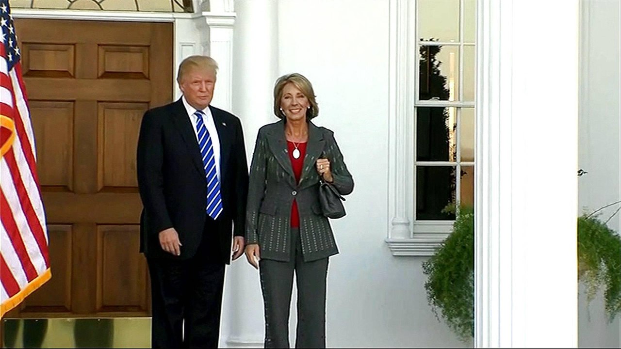 Betsy DeVos narrowly sworn in as US education secretary