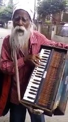 old is god tallent this elddr man have a good music sence and voice