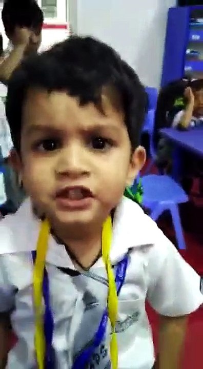 A Little Boy Is Singing A Song Very Well