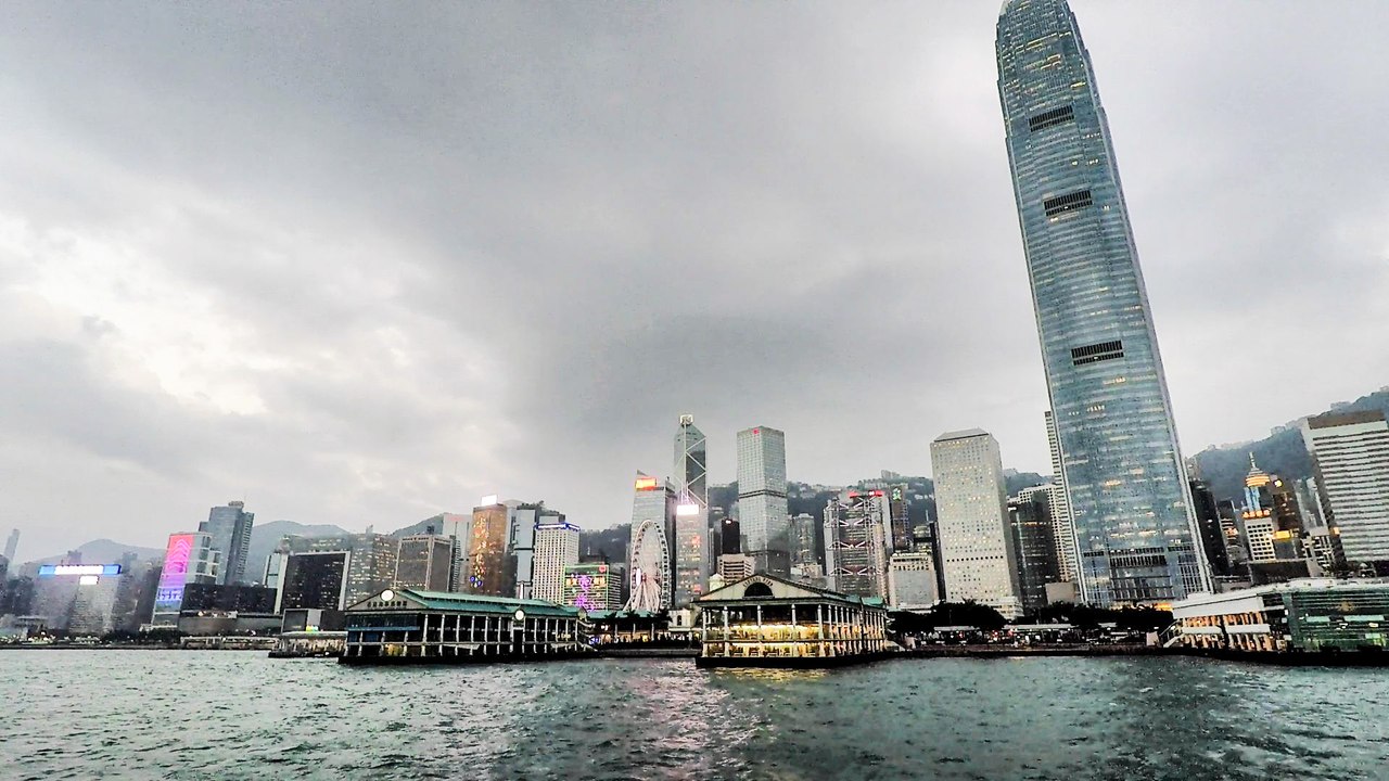 Hong Kong Skyline at Sunset. Rides Across Victoria Harbour on the Star Ferry