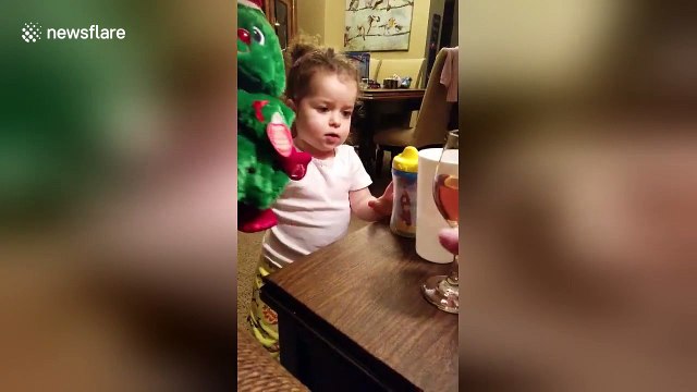 Girl, 2, 'serves' wine to her toys