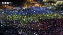 Protesters recreate massive Romanian flag as thousands rally at Victory Square