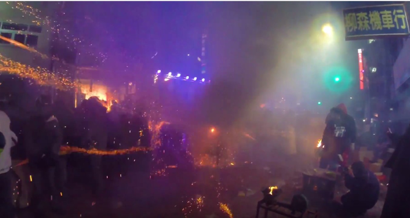 Festivalgoers Wear Helmets in Face of Fireworks Display