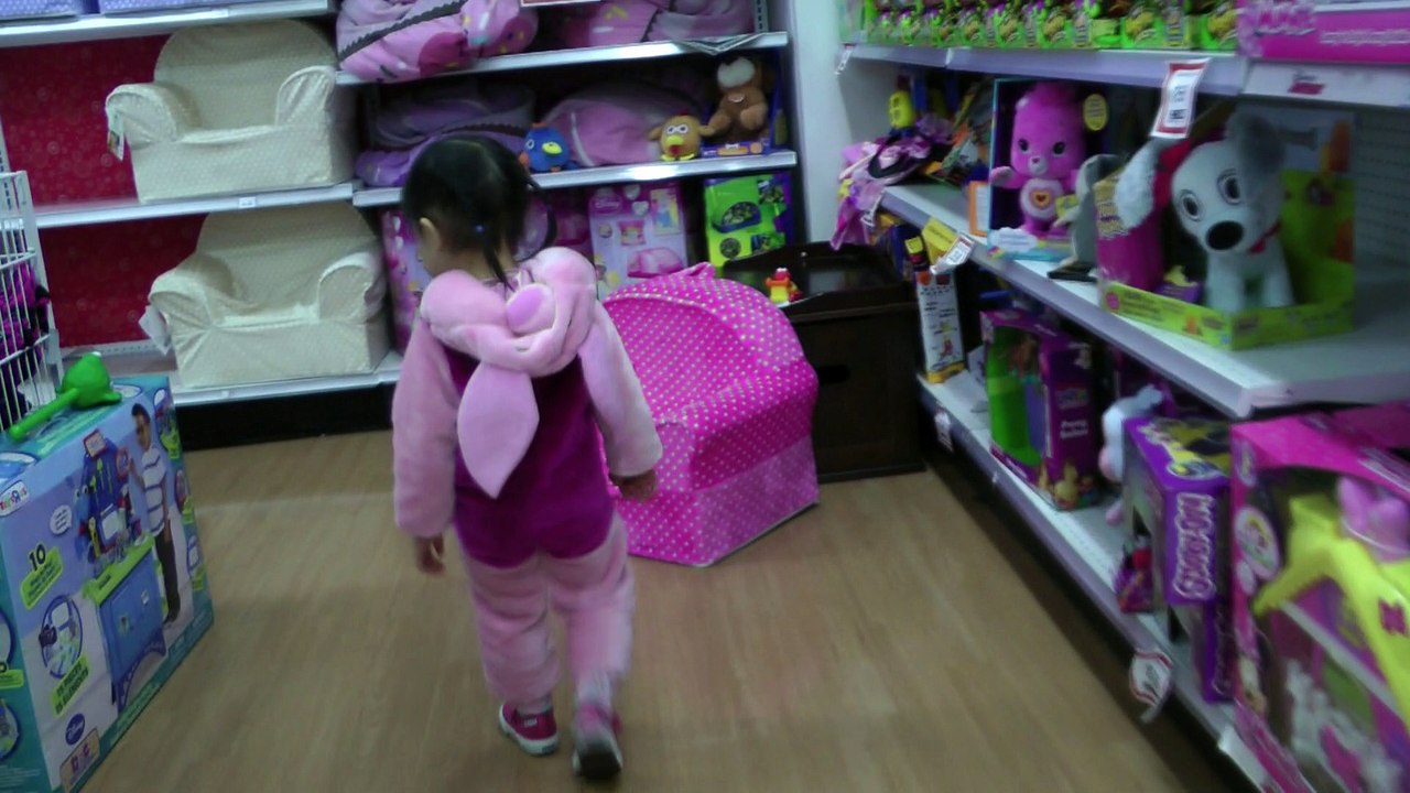 Girl Looking At New Toy