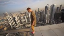 Crazy man rides HOVERBOARD on edge of Dubai Skyscraper