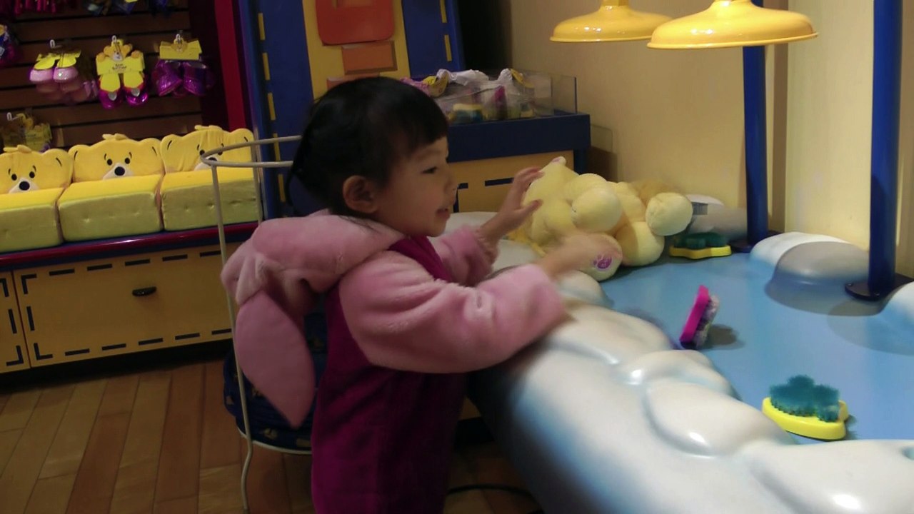 Girl Washing The Doll