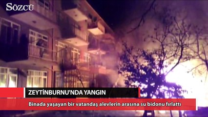 Yangını söndürmek için su bidonu fırlattı