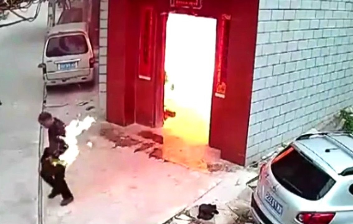 Man On Fire Runs Out Of Building After Explosion