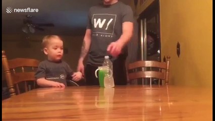 Two year old boy takes bottle flipping to the next level