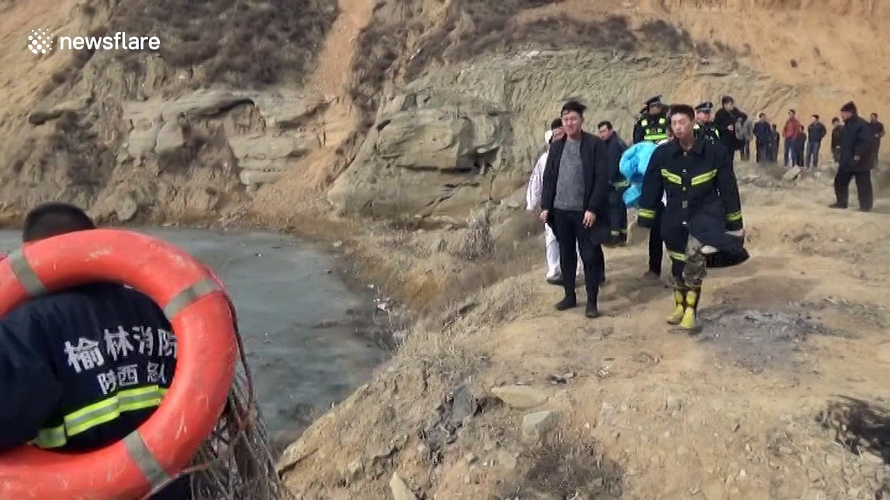 Firefighters rescue a boy trapped on icy lake