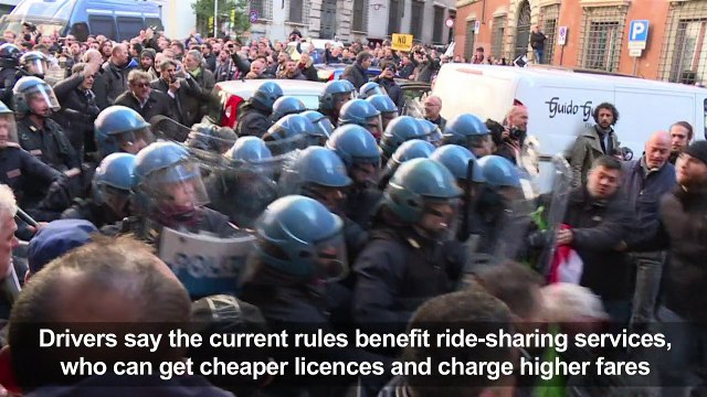 Italian taxi drivers clash with police during protest over Uber