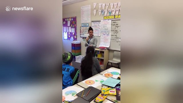 Fourth grade teacher raps for students