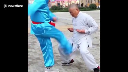 Chinese kung fu masters show off their “balls of steel”