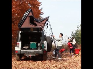 This cargo bin transforms into a massive tent on top of your car.