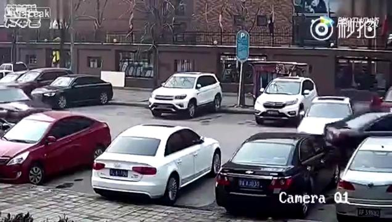 White BMW hits black Chevy out of parking space
