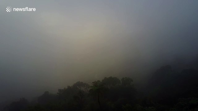 Drone breaking through clouds unveils stunning scenery
