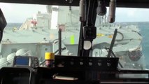 Lynx helicopter landing on ship in rough sea