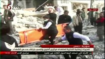 Suicide attacks on bases in Syria's Homs kill dozens