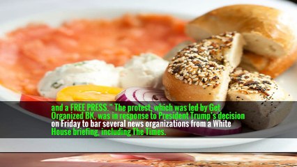 “It’s a New York Sunday tradition,” read a sign held by Norman Cohen, a freelance TV producer, “Coffee, Bagels,