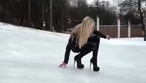 Elle fait une lourde chute en talons sur la neige !