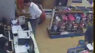 Foreign tourist circus with the cashier at the store computer