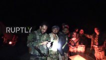 Syrian Arab Army troops celebrate Palmyra victory