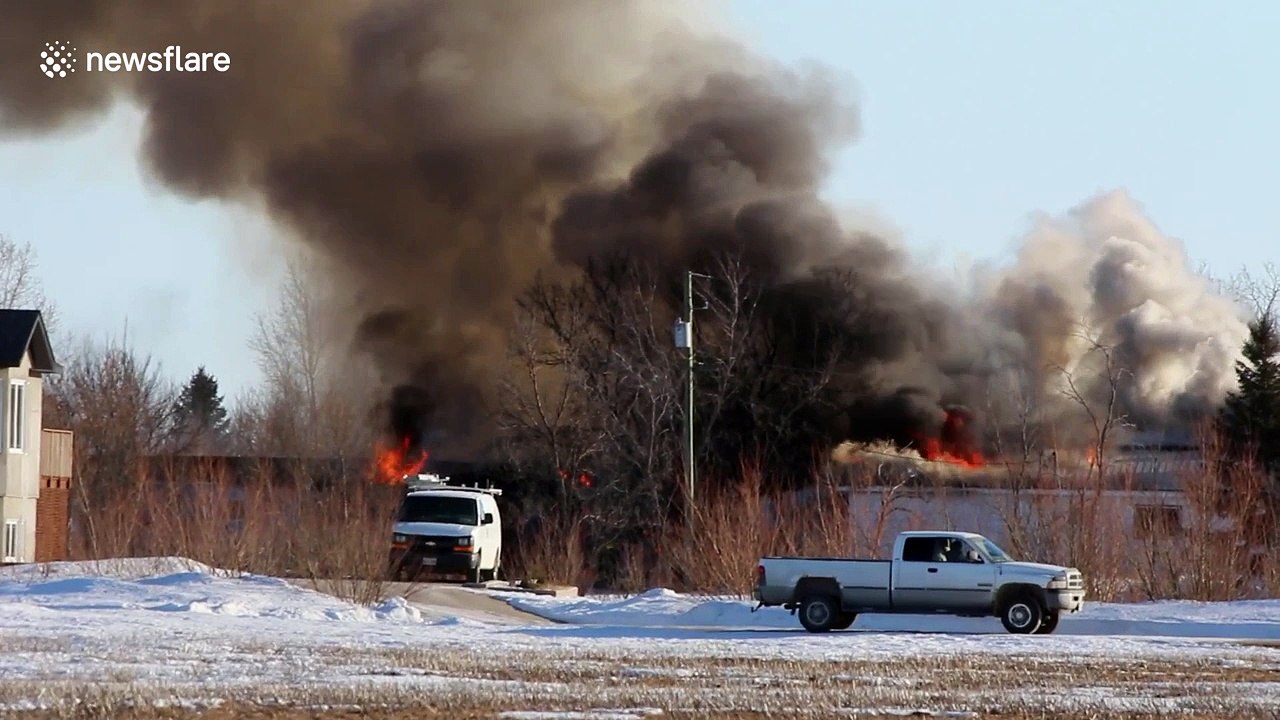 Firefighters battle raging house fire