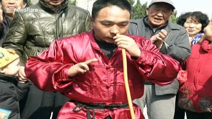 Kung fu master inflates tyre with nose