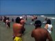 Bathers on the beach attending a very rare visit. The video goes viral