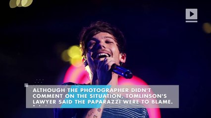 One Direction's Louis Tomlinson arrested at LAX after fight with paparazzi
