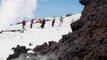 Rolling lava rocks sizzle as they hit snow and ice during Mount Etna eruption