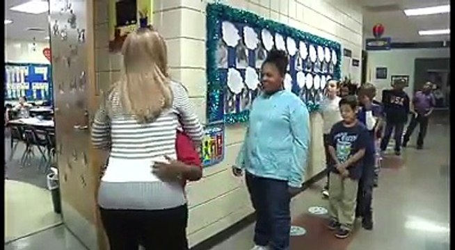 3rd grade teacher doing personalized handshakes