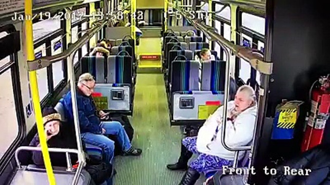 A pickup truck crashes into and gets stuck in a bus