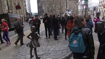 'Fearless Girl' statue stares down Wall Street's iconic bull