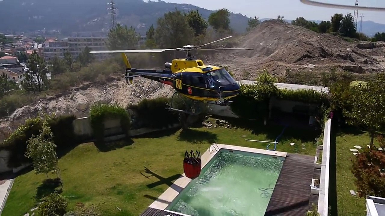 Amazing helicopter Pilot taking water from Swimming pool
