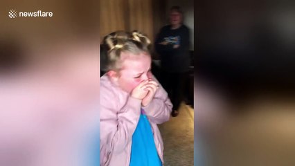 Puppy surprise brings girl to tears