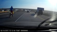 Motorcycle rider bails at the last second to avoid collision