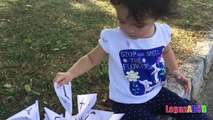 Toddler learning ABC Alphabets on a White Flags _ Fun outdoors park-nQaIsXv