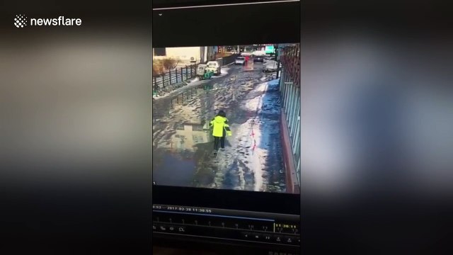 Woman narrowly escapes being crushed by snow falling from rooftop