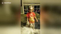 Toddler gets carried away with baby powder