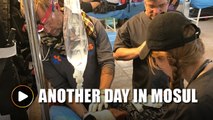 US volunteers aid Mosul's wounded in makeshift frontline clinic